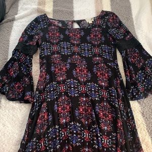 Black dress with pink and blue designs